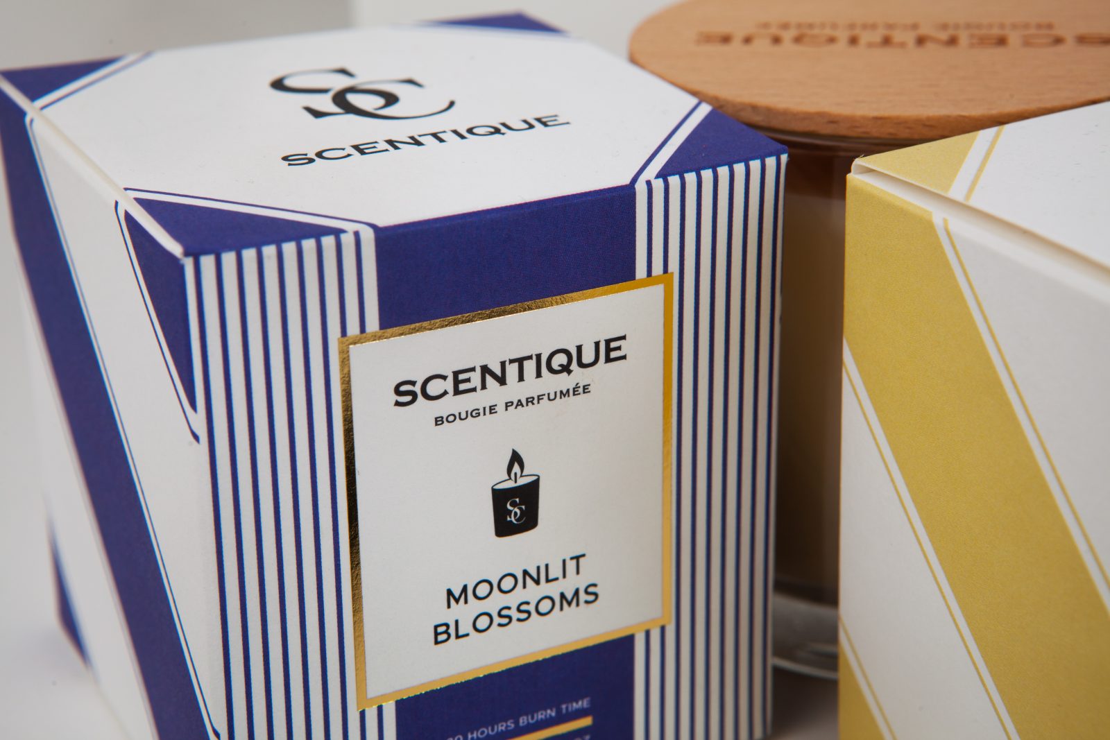 Scentique's Elegant Candle Packaging By The Offset Group
